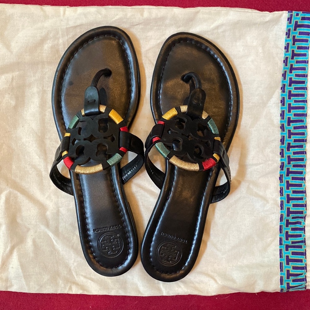 Tori Burch black sandals with colorful detailing.